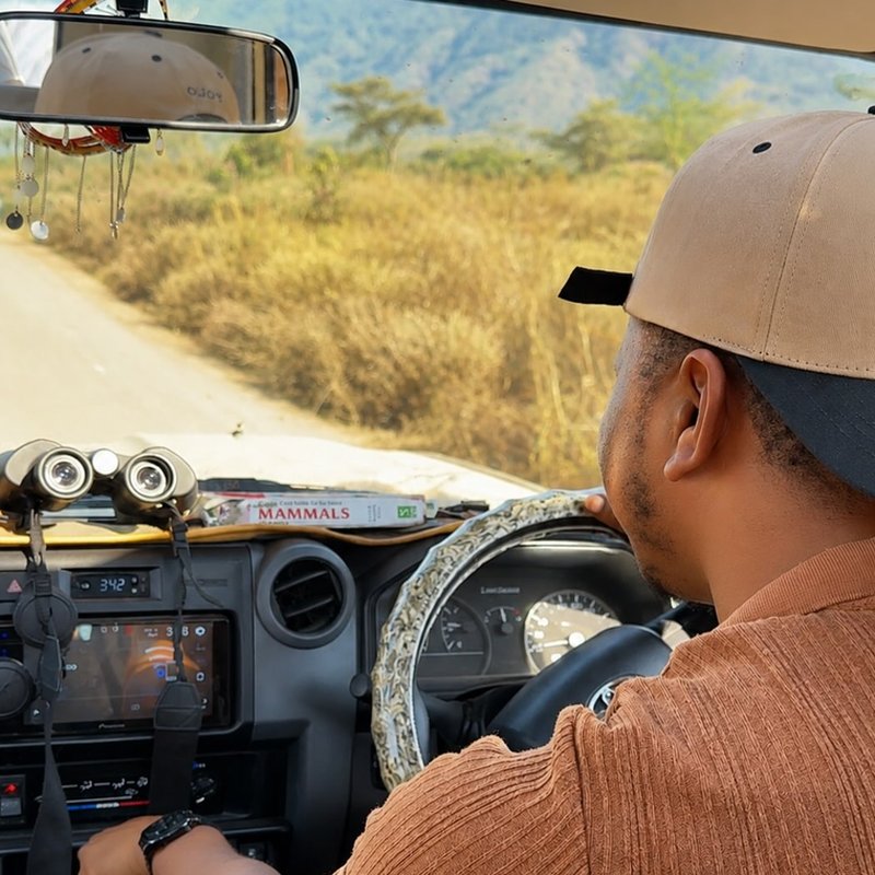 Justine Khadallah driving guests through the Tanzanian bush